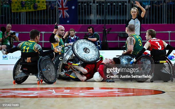 September 7: Lars Mertens of Belgium falls to the floor after clashing with Chris Bond of Australia during the Mixed Wheelchair Rugby - Open match...
