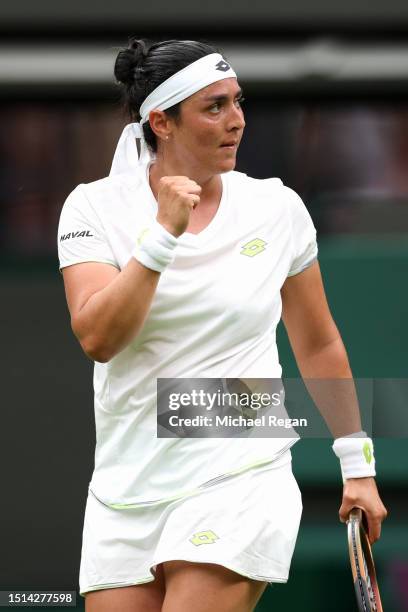 Ons Jabeur of Tunisia celebrates winning match point against Magdalena Frech of Poland in the Women's Singles first round match during day two of The...