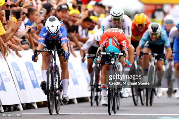 Jasper Philipsen of Belgium and Team Alpecin-Deceuninck and Caleb Ewan of Australia and Team Lotto Dstny sprint at finish line during the stage four...