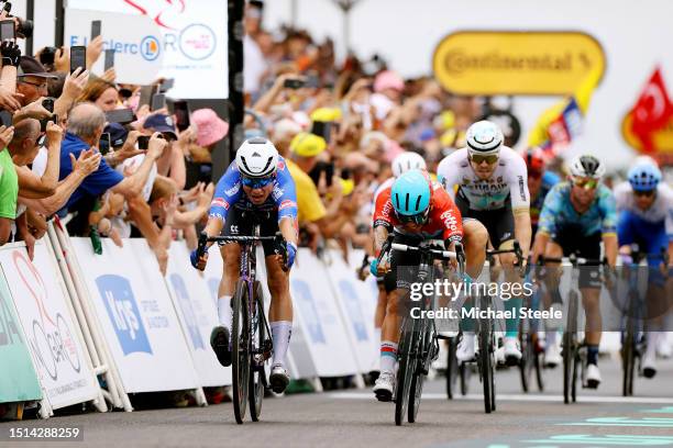 Jasper Philipsen of Belgium and Team Alpecin-Deceuninck and Caleb Ewan of Australia and Team Lotto Dstny sprint at finish line during the stage four...