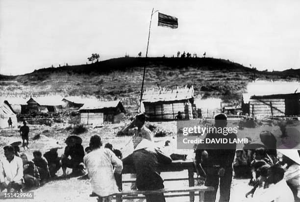 The Vietnamese flag flies over the village of Mai Lai 19 November 1969, where some 600 villagers were allegedly massacred by U.S Americal Division...