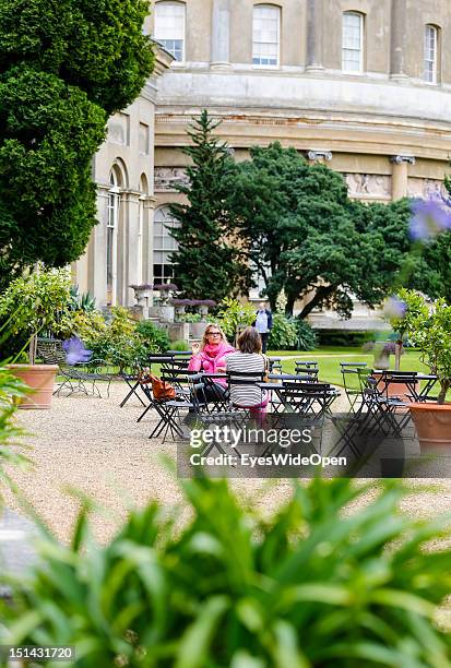 Ladies are sitting on a terrace of an cafe at the gardens of the country house Ickworth House on August 7, 2012 in London, Suffolk, England, United...