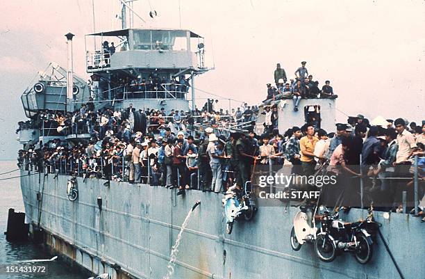 Jampacked with more than 7,000 refugees, the South Vietnamese Navy ship HQ-504 arrives at Vung Tau port, the South Vietnam' s most popular sea...