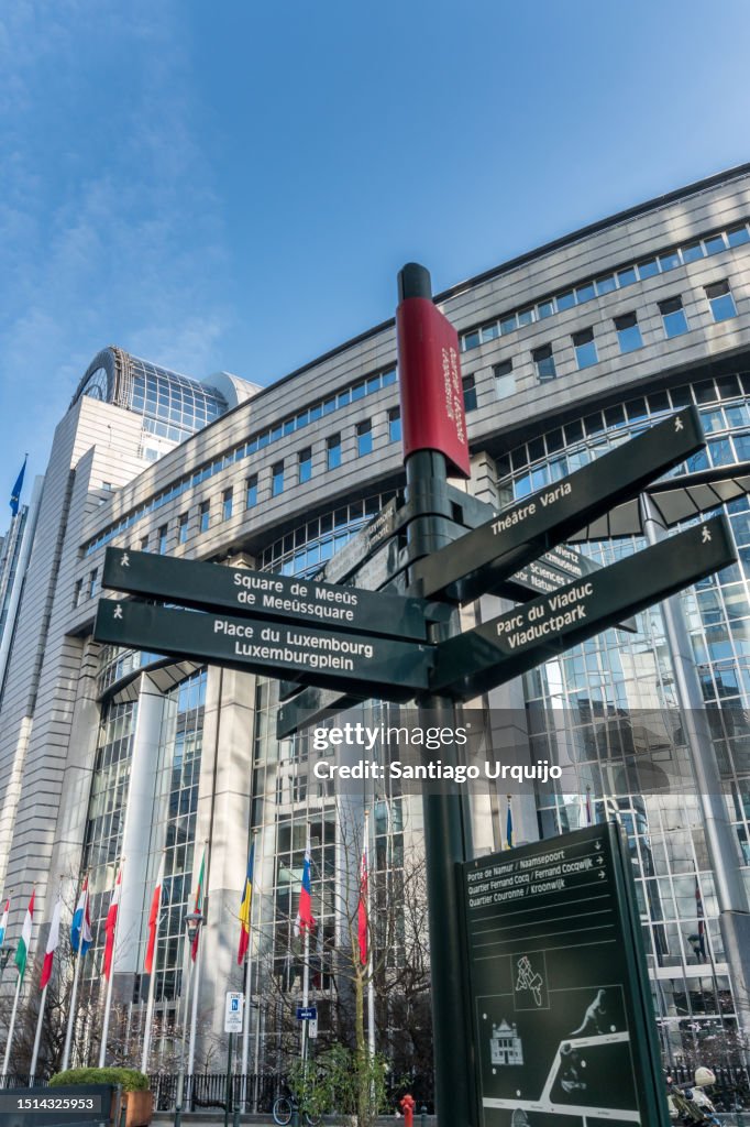 Street sign post in front of European Parliament building