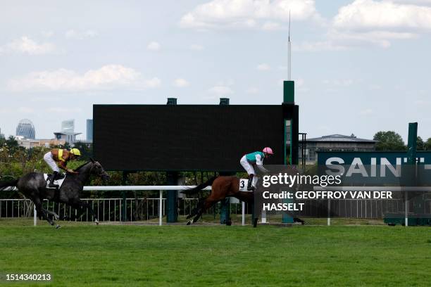 British jockey Rob Hornby rides Westover to victory in the Grand Prix de Saint-Cloud horse race at Hippodrome de Saint-Cloud on the outskirts of...