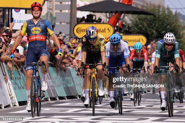 Lidl - Trek's Danish rider Mads Pedersen cycles to the finish line ahead of Jumbo-Visma's Belgian rider Wout Van Aert , Team Jayco Alula's Dutch...