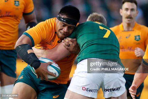 Australia's prop Allan Alaalatoa is tackled by South Africa's flanker Pieter-Steph du Toit during the Rugby Championship first round match between...