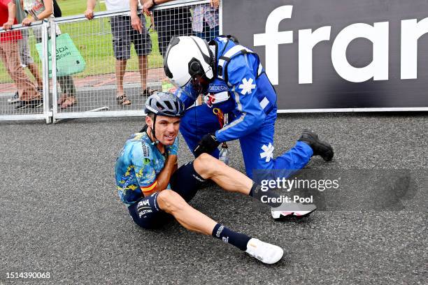 Luis León Sánchez of Spain and Astana Qazaqstan Team is assisted by medical services after being involved in a crash at finish line during the stage...