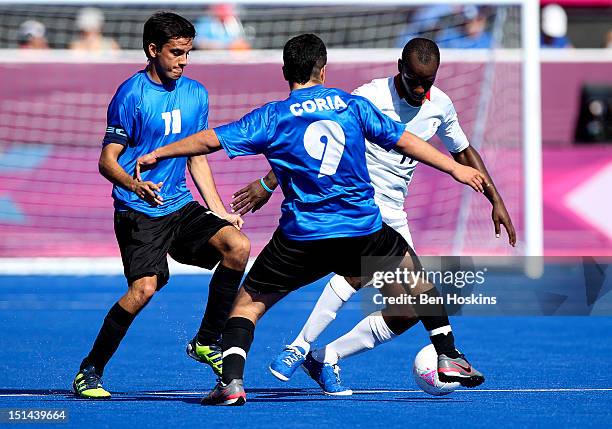 Ibz Diallo of Great Britain takes on Matias Fernandez Romano and Fabio Coria of Argentina during the Men's 7-a-side football 5-8 place Semi Final on...