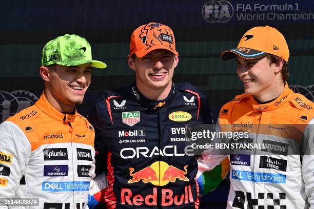 Pole position winner Red Bull Racing's Dutch driver Max Verstappen poses with second placed McLaren's British driver Lando Norris and third placed...