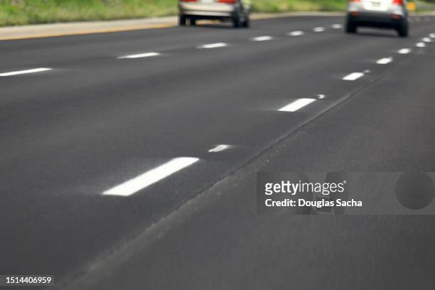 painted dividing lines on the highway - chasing perfection stock pictures, royalty-free photos & images