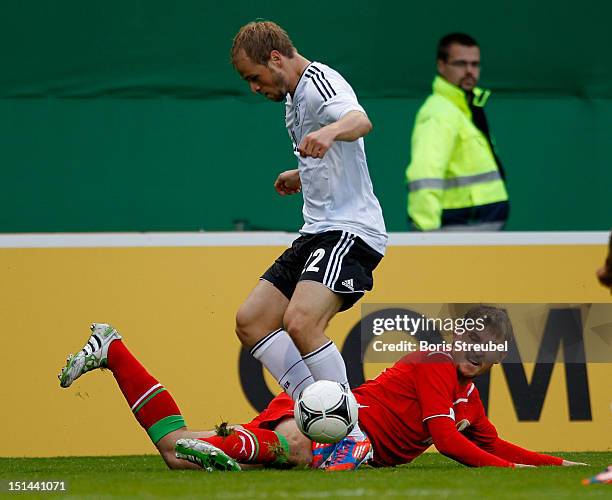 Maximilian Beister of Germany and Aliaksandr Aniukevich of Belarus battle for the ball during the Under 21-Euro qualifier match between Germany U21...