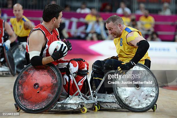 Mikael Norlin of Sweden clashes with Mike Whitehead of Canada during the Mixed Wheelchair Rugby - Open match between Canada and Sweden on Day 9 of...