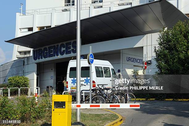 Picture taken on September 7, 2012 shows an ambulance arriving at the emergency unit in the CHU Hospital, in Grenoble, French Alps, where the two...