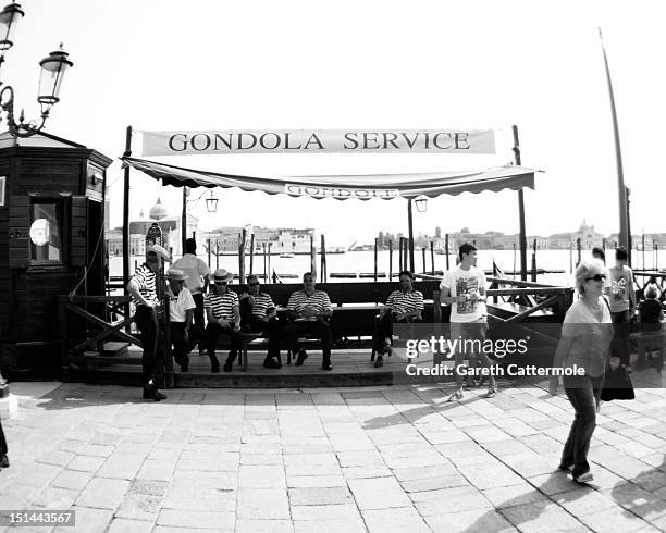 Gondolier's relax during the 69th Venice Film Festival at the Palazzo del Cinema on September 7, 2012 in Venice, Italy.