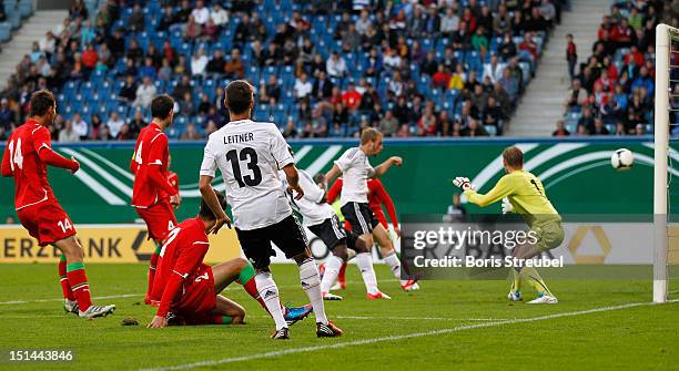 Maximilian Beister of Germany scores his team's first goal vs. Goalkeeper Siarhei Ihnatovich of Belarus during the Under 21-Euro qualifier match...