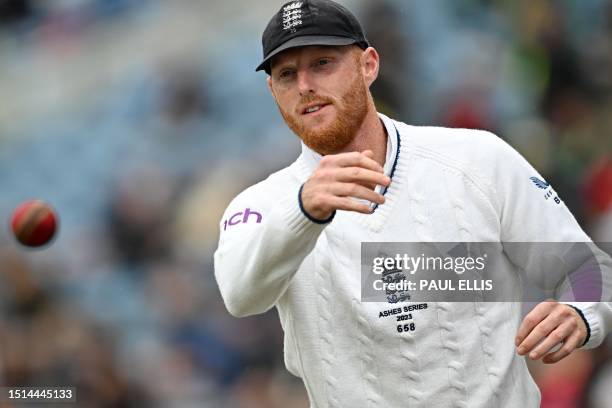 England's captain Ben Stokes warms up before the delayed start of play on day three of the third Ashes cricket Test match between England and...