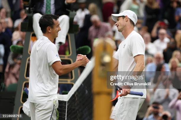 Andy Murray of Great Britain interacts with defeated Ryan Peniston of Great Britain after their Men's Singles first round match during day two of The...