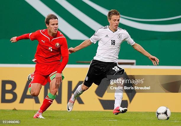 Patrick Hermann of Germany and Ilya Tsyvilka of Belarus battle for the ball during the Under 21-Euro qualifier match between Germany U21 and Belarus...