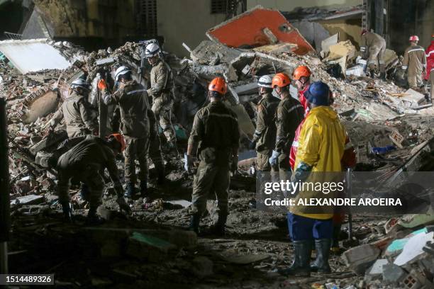 Rescue teams search for victims in the rubble of a collapsed building in the municipality of Paulista, on the outskirts of Recife, in Brazil's...