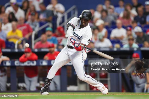 Jesus Sanchez of the Miami Marlins hits a three-run home run against the St. Louis Cardinals in the first inning at loanDepot park on July 04, 2023...