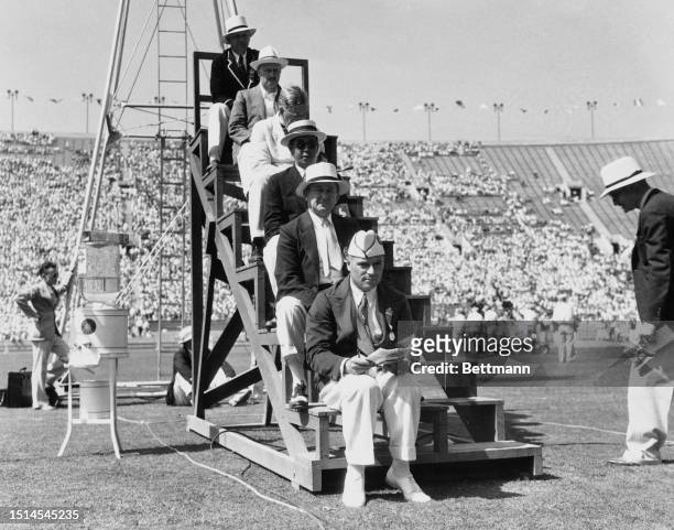 Judges; Dino Nai , George. V. Brown , Shinichi Yosharka , George Kivagh , J.W. Turner and W.H. Chilos seated on their platform at the finish line of...