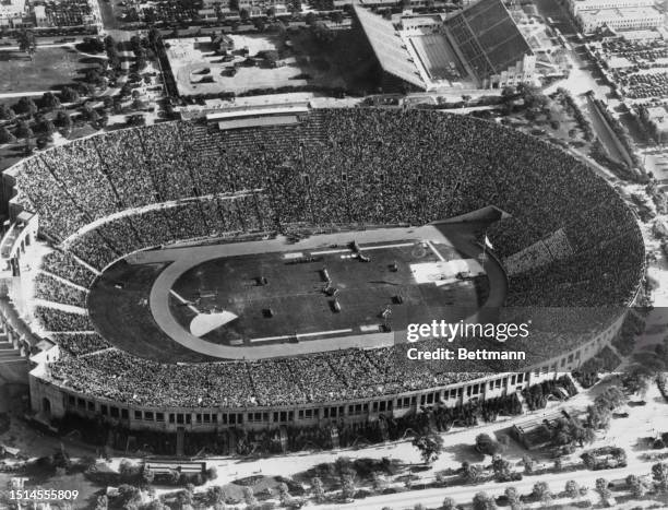 An aerial view of the closing ceremonies, as athletes paraded about the enclosure which formed the battlefield on which they fought for the Laurel...