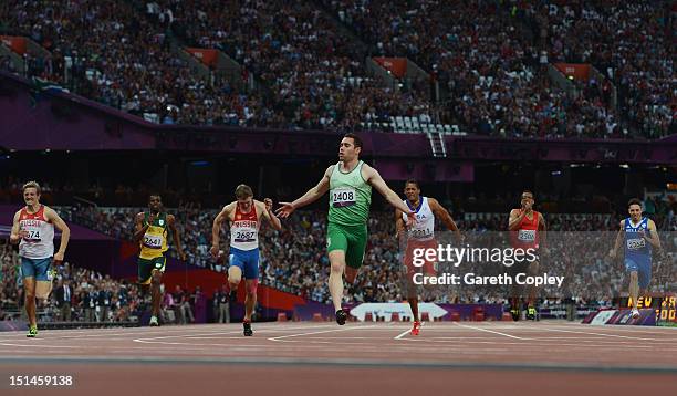 Jason Smyth of Ireland crosses the line to win gold in the Men's 200m T13 Final on day 9 of the London 2012 Paralympic Games at Olympic Stadium on...