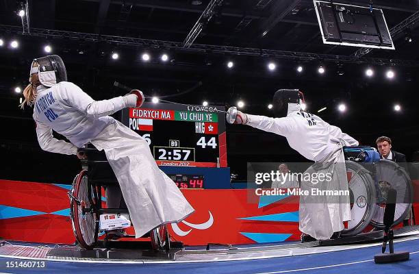 Dagmara Witos-Eze of Poland in action with Pui Shan Fan of Hong Kong, China during the Women's Team Wheelchair Fencing on day 9 of the London 2012...