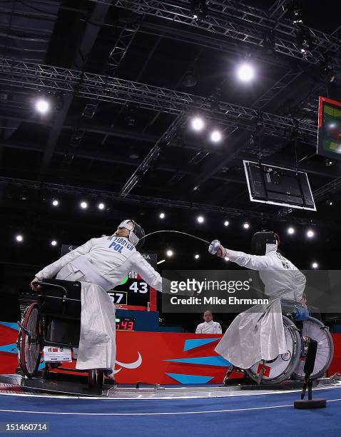 Dagmara Witos-Eze of Poland in action with Pui Shan Fan of Hong Kong, China during the Women's Team Wheelchair Fencing on day 9 of the London 2012...