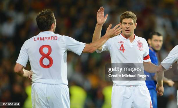 Frank Lampard celebrates scoring to make it 2-0 with Steven Gerrard during the FIFA 2014 World Cup qualifier match between Moldova and England at...