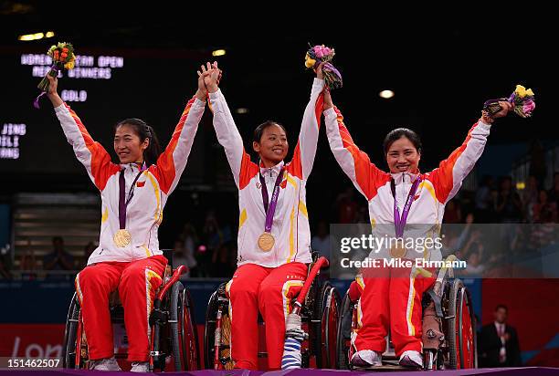 Jing Rong, Baili Wu, and Fang Yao of China celebrate winning the Gold Medal in the Women's Team Wheelchair Fencing on day 9 of the London 2012...