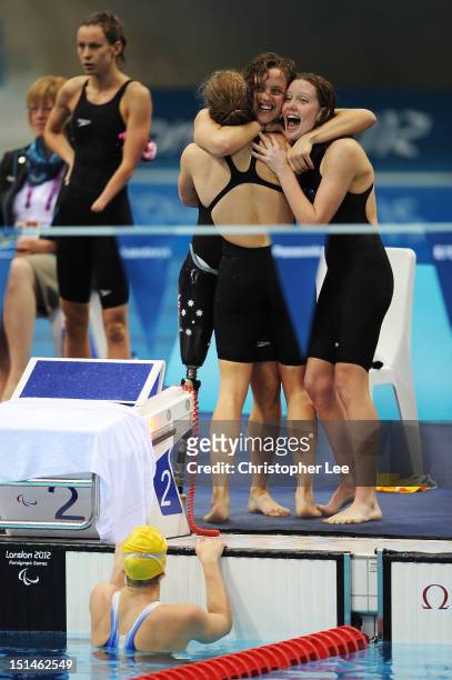 Jacqueline Freney, Annabelle Williams, Ellie Cole and Katherine Downie of Australia celebrate winning the gold in the Women's 4x100m Medley Relay -...