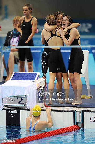 Jacqueline Freney, Annabelle Williams, Ellie Cole and Katherine Downie of Australia celebrate winning the gold in the Women's 4x100m Medley Relay -...