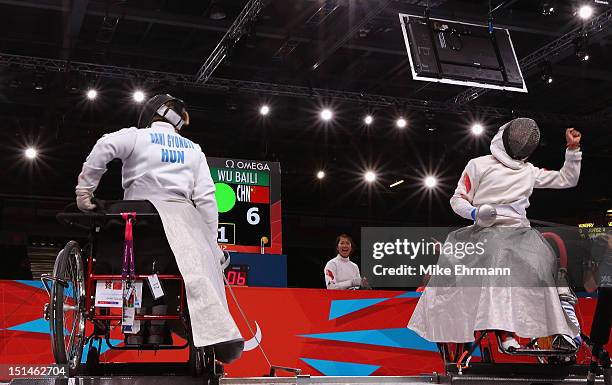 Gyongyi Dani of Hungary and Baili Wu of China compete during the Women's Team Wheelchair Fencing on day 9 of the London 2012 Paralympic Games at...