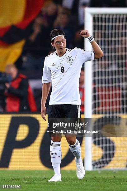 Mesut Oezil of Germany celebrates the second goal during the FIFA 2014 World Cup Qualifier group C match between Germany and Faeroe Islands at AWD...