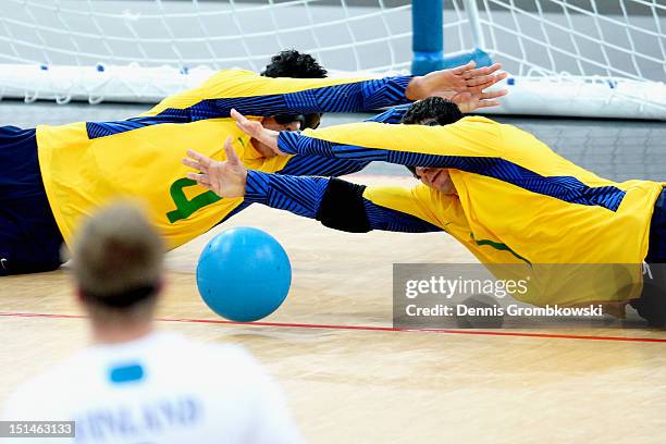 Leomon Moreno Da Silva of Brazil and teammate Jose Roberto Ferreira De Oliveira block the ball during their Men's Team Goalball Gold Medal match...