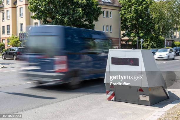speed camera with a fast car - lasergun stockfoto's en -beelden