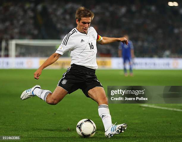 Philipp Lahm of Germany controls the ball during the FIFA 2014 World Cup Qualifier group C match between Germany and Faeroe Islands at AWD Arena on...