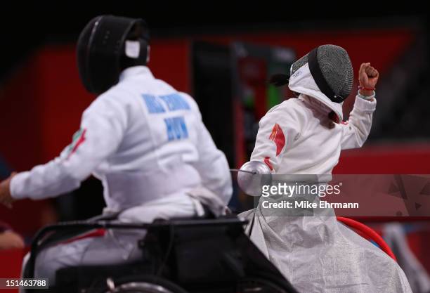 Gyongyi Dani of Hungary and Baili Wu of China compete during the Women's Team Wheelchair Fencing on day 9 of the London 2012 Paralympic Games at...
