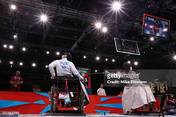 Zsuzsanna Krajnyak of Hungary and Baili Wu of China compete during the Women's Team Wheelchair Fencing on day 9 of the London 2012 Paralympic Games...