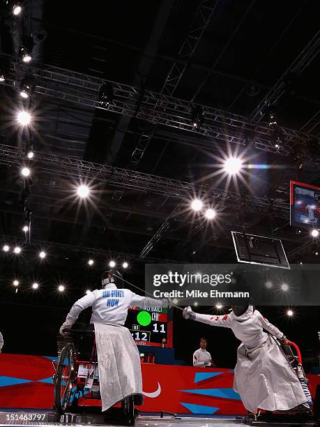 Zsuzsanna Krajnyak of Hungary and Baili Wu of China compete during the Women's Team Wheelchair Fencing on day 9 of the London 2012 Paralympic Games...