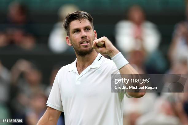 Cameron Norrie of Great Britain celebrates winning match point against Tomas Machac of Czech Republic in the Men's Singles first round match during...