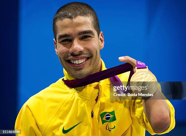 Daniel Dias of Brazil celebrates a victory in the Men's 50m Butterfly - S5 final on day 9 of the London 2012 Paralympic Games at Aquatics Centre on...