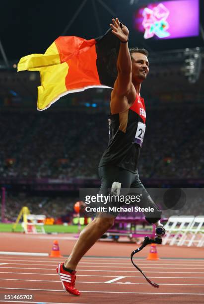 Heinrich Popow of Germany celebrates as he wins gold in the Men's 100m T42 on day 9 of the London 2012 Paralympic Games at Olympic Stadium on...