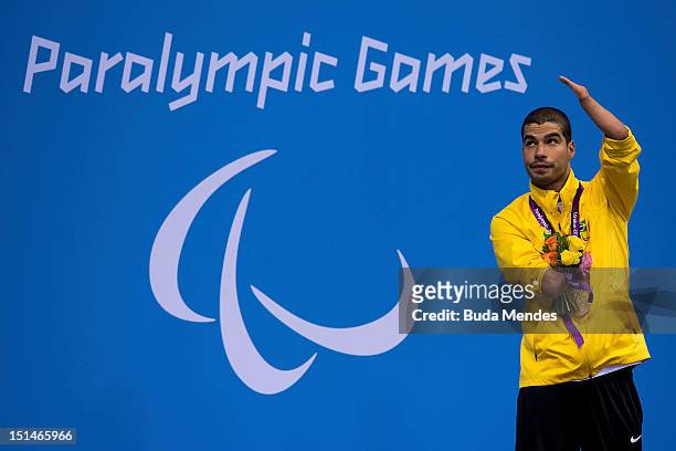 Daniel Dias of Brazil celebrates a gold medal in the Men's 50m Butterfly - S5 final on day 9 of the London 2012 Paralympic Games at Aquatics Centre...