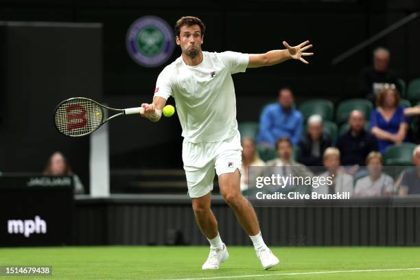 Quentin Halys of France plays a forehand against Daniel Evans of Great Britain in the Men's Singles first round match during day two of The...