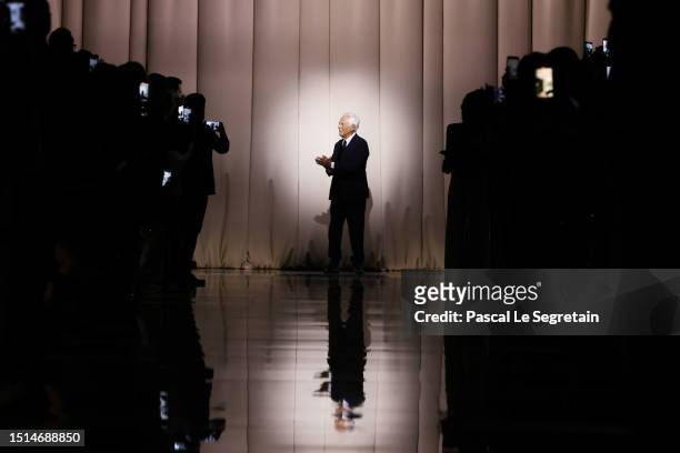 Fashion designer Giorgio Armani acknowledges the applause of the audience after the Giorgio Armani Privé Haute Couture Fall/Winter 2023/2024 show as...