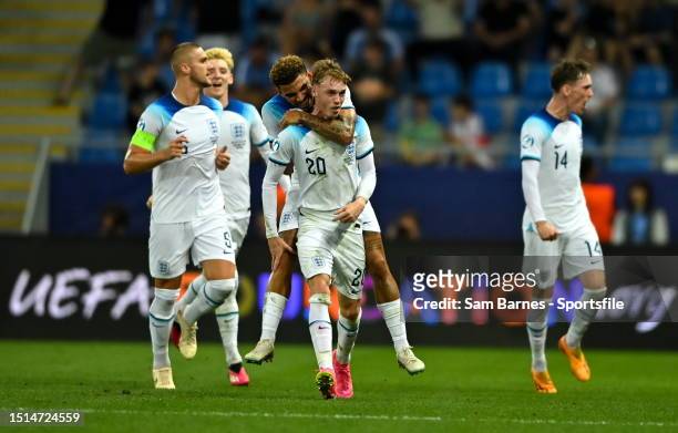 Cole Palmer of England celebrates his side's first goal with team mates, scored by teammate Curtis-Jones, not pictured, during the UEFA Under-21 EURO...