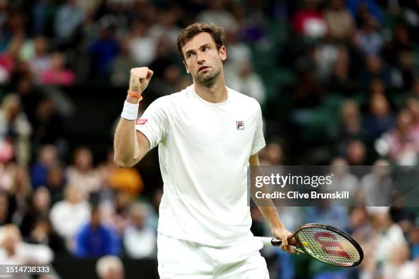 Quentin Halys of France celebrates against Daniel Evans of Great Britain in the Men's Singles first round match during day two of The Championships...